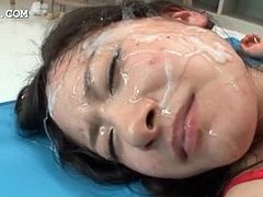 Big boobed asian brunette tramp gets face covered in hot jizz