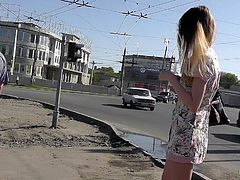 Skinny blonde gets filmed by dirty voyeur while in public scene
