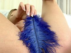 Watch as she seductively teases you the viewer by slowly rubbing a blue feather all over her pretty body. She rubs it against her clit for a tingling sensation the she sticks her fingers deep inside her pussy.