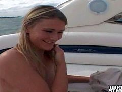 Arousing skillful blonde milf Cassandra with huge natural tits and pierced belly button in sexy outfit gets naked and gives hot blowjob to the captain on his boat on a lazy afternoon