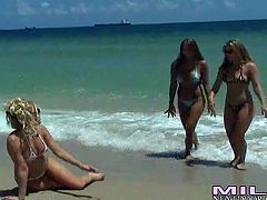 Long haired nasty brunettes Kristen Pierce and Brianna Ray with hot bodies and their stunning friend tease with delicious firm buns on the beach and have hot threesome in hotel room