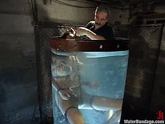 Kinky Latin bitch in latex gets tied up to a chair and gets toyed in her ass. She also gets whipped and then drowned in an aquarium.