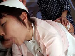 Slutty Japanese chick Tsubomi is playing dirty games with two men. She lets them touch her privates and then demonstrates her cock-sucking talent.