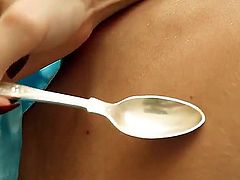 The pretty girlie is taking everything off exposing some of sweetest parts of hers. She takes spoon after that and starts pushing it into snatch moaning from delight.