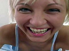Short haired blonde teases in close up