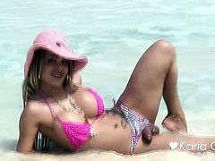 Karla Carrillo on the beach in pink