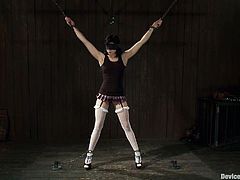 Asphyxia Noir is the naughty brunette who's going to go through some crazy stuff in this video where she'll endure extreme bondage and toying.