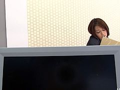 Skanky black haired Japanese secretary Maki Hojo takes telephone calls and strokes her hungry pussy at the same time. Then she stimulates her hairy pussy with egg vibrator.
