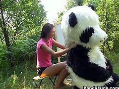 Brunette teen girl is playing with her panda bear. Panda turns out to bbe kinky and horny. Watch as she gets naked and he fucks her hard.