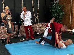 Elegant rich lady is watching a young cheap hussy fighting in a ring with a sumo teacher before she stands on her knees to oral fuck his sturdy penis in sultry sex video by Tainster.