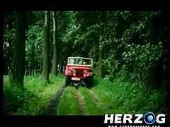 In this retro porn a romantic guy decides to take his lady for a nice ride into the woods in her jeep. When they arrive at a secluded location, she sucks on his cock with great pleasure. They return home and fuck some more.