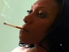 Stunning ebony likes smoking while playing with her juicy cunt in solo
