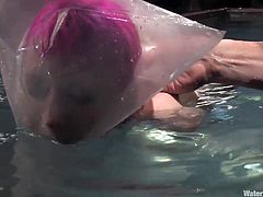 A submissive fucking slut with pink hair gives herself up to be the victim of this sadist motherfucker and his water torture.