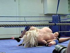 Liz and her lusty lesbian friend enjoy in fighting on the floor in the gym and have a hot nude wrestling session in front of the camera crew and have fun