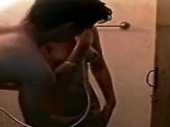 Steamy brunette milf takes a shower before a kinky young dude joins her. They hug with passion before he goes down to tongue fuck her delicious vagina in homemade sex video by Indian Sex Lounge.
