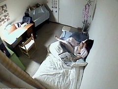 Watch an alluring Japanese brunette belle playing with her hairy pussy in her room in this awesome voyeur vid.