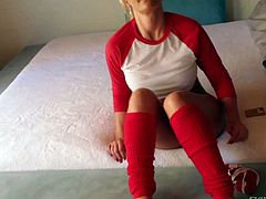 Phoenix Marie is a sexy bodied blonde pornstar dressed in red and white. She bares her bubble as and fingers her asshole after interview. Then asslicious porn diva exposes her bare feet.