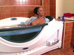 She is voluptuous mommy with big boobs. She soaps her junk bathing a bubbly bath tub. Then she inserts dildo in her wet cunt poking it actively.