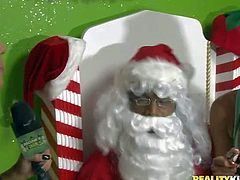 Aroused babes in Christmas costumes enjoy in getting some really interesting toys this year from Santa and have fun in playing with them for the cam as well