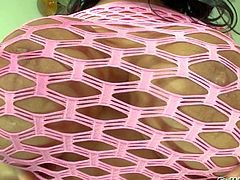 Sienna West is a gorgeous dark haired sexy milf with bubble ass and huge tits. She spreads her round buttocks in front of a lucky guy before she gets her massive tits licked. She removes her pink fishnet dress and shows her assets.