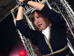 A cute japanese chick in nurse costume is tied to the rack and is about to get punished. Her big naturals got squeezed and her tiny pussy too!