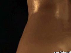 Check out this sexy Indian dancer from Bollywood. She shows her luscious body and oils it all up to show you some Kamasutra massages!