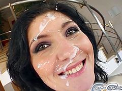 After sucking some huge dicks, brunette babe enjoys warm jizz splashing her face