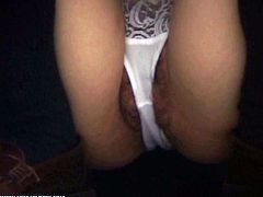 This teen's panties are between her pussy lips. Her black pubic hair can be seen around her white panties.