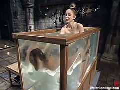 Cute fair-haired girl Audrey Leigh is playing BDSM games with her lesbian GF in a basement. The mistress fucks Audrey's cooch with a toy and then drowns the girl in a bathtub.