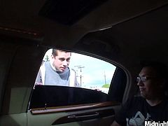 Spoiled brunette babe sits between two horny men on car seat with legs wide open while they rub her tights and big firm tits with their spoiled hands in peppering MMF sex clip by Pornstar.