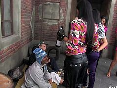 These chicks are so horny that it is really scary! When they get joined by some homeless men it doesn't take long before they are sucking off their cocks.