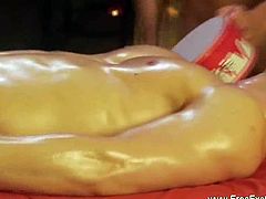 Hot oild up hunk is laying on a massage table receiving a hot and steamy erotic massage and getting is cock jerked off.