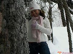 Cuddly babe with beautiful face is playing with snow outdoor. She gets horny so she starts to rubs her hot titties and pussy with snow.