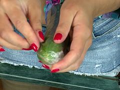 Curvy stunner with big boobs sucks long cucumber imitating deepthroat blowjob. Then she inserts the vegetable in her tasty wet cherry. Exciting masturbation session in the kitchen with gorgeous brunette babe.