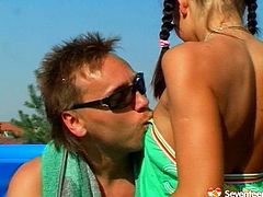 Perverse dude seduces a fresh faced long legged brunette amateur by the pool. He caresses her small perky tits with his tongue before she accepts his huge penis inside her mouth for a blowjob.