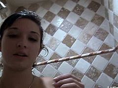 Bailey is a horny brunette teen. She rubs her bald cunt under the shower and then she poses some more.