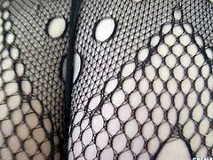 This beautiful shemale sits back in her favorite chair and sticks her hand down her fishnet stockings to grab her thick cock. The tip of her cock pokes out through her fishnet stockings as she jerks off her stiff penis.