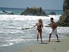 This horny couple is spending some precious time together on the beach when their lust is pushing them to do something naughty. As soon as they arrive home, the guy wastes no time and goes down on her. He licks this gorgeous babes shaved cunt right after kissing her lips.