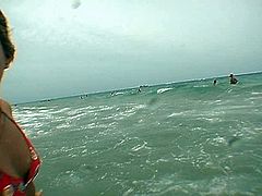 Beefy utterly sexy dude notices two fuckable young chics lying at the beach taking a sunbath. He offers them to swim in the ocean wearing tiny raunchy swimsuits in peppering sex clip by Pornstar.