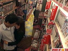 Check a naughty Japanese milf devouring her man's dong in the dvd store in this hot public sex video.