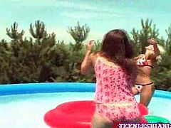 These hot teen chicks were frolicking in the pool when they ended up getting horny and splashing each other
s cute bodies hoping for naked lesbian action.