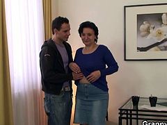 This young man picks up a woman from the city's center. He brings her home and fucks her old hairy snatch.