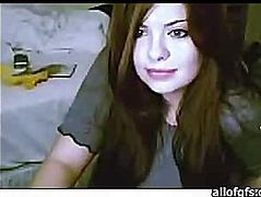 Cute brunette sitting in front of web camera