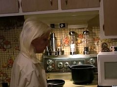 Kinky blonde chick with perky small tits is having coffee in the kitchen. Then she cooks for her BF wearing his shirt. Homemade video.