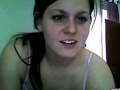 Fondles her pussy sitting in front of web camera