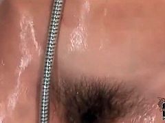 Cute girl masturbates hairy vagina in the shower