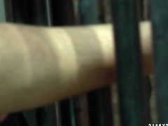 Imprisoned blond prostitute kneels down in front of a horny supervisor to give him a blowjob through the bars of her cage with a collar on her neck and hands cuffed in BDSM sex video by 21 Sextury.