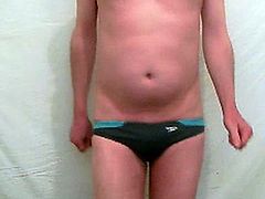 BOY TAKES ALL HIS CLOTHES OFF AND HIS SWIMMING TRUNKS AND DANCES COMPLETLY NUDE .