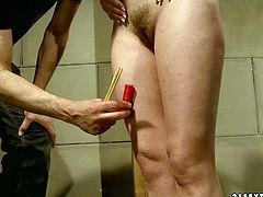 Small titted brunette doxy gets tied to a wooden column bandaged before a kinky master takes a lighten candle to pour hot wax on her tits and later on her ass in BDSM-involved sex video by 21 Sextury.