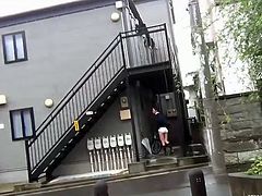 This Japanese schoolgirl lifts her uniform skirt to show off her hairy cunt and ass on the street. Then, she puts a vibrator between her pussy lips and enjoys.